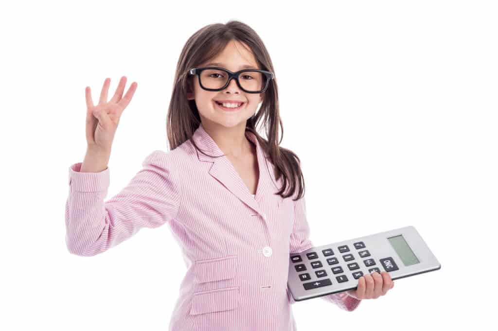 Girl holding calculator and holding up four fingers